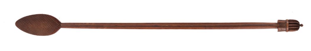A 19th Century treen back scratcher, with geometric flowerhead decoration to the pointed ovoid end,