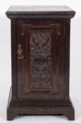 A late Victorian/Edwardian dark oak pedestal cabinet, the interior fitted with three filing drawers,