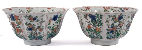 A pair of Chinese famille verte bowls of moulded lobed form, enamelled with flowering branches,