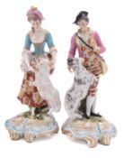 A pair of Continental figures of a shepherd and shepherdess in Chelsea style,