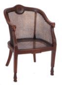 A Contemporary beech frame Bergere armchair, in the Regency taste,