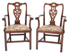 A pair of George III mahogany library elbow chairs,