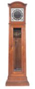 An electric master longcase clock the square black dial having an applied chrome chapter ring and