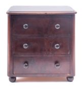 A miniature Victorian walnut chest of drawers,