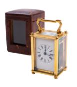 An Edwardian brass miniature carriage timepiece the eight-day duration timepiece movement having a