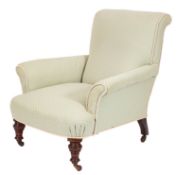 An Edwardian walnut frame armchair, fully upholstered in pastel green fabric,