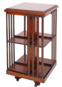 A burr walnut and marquetry revolving bookcase in Edwardian style,