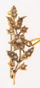 A seed pearl brooch, of flower and folia