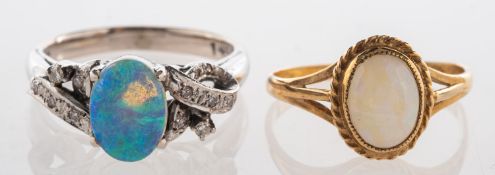 A group of two opal rings, one set with