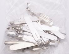 A group of silver fruit knives and forks