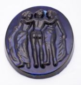 A blue glazed stoneware oval relief plaq