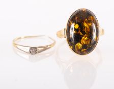 An amber ring and a diamond ring, a ring