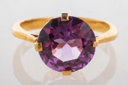 A four claw ring, set with a circular-cu