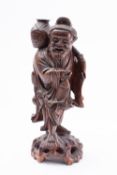 Chinese root wood carving of an elderly