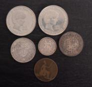 An altered Victorian penny, Queen Victoria as a Jockey, with 1901 and 1892 half crowns,