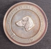 A boxed 1913, 50mm, Reichmond Best Daschhund in Show, Miss E Woods.