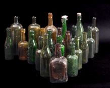 A collection of various glass bottles, various retailers and makers.