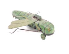 An early 20th century German tinplate clockwork grasshopper, green litho printed body and wings,