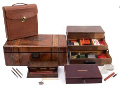 A late 19th century inlaid walnut writing slope, together with two leather stationary cases,