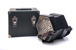A Wheststone & Co duet system concertina, serial number 26742, with fifty eight metal buttons,
