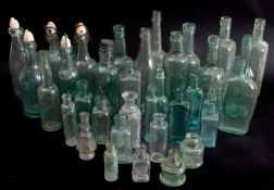 A collection of various glass bottles, various retailers and makers.