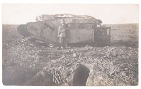 Two albums of WWI postcards including a photograph of a German soldier standing beside a captured