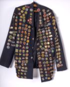 A BR blue cloth jacket decorated with a collection of ASLEF and Railway related enamel badges.