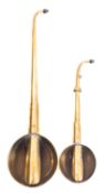 Two 19th century brass ear trumpets, both with turned ebony ear pieces,