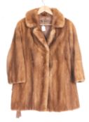 A mid 20th century lady's mink half length jacket, unsigned, with brown silk lining.