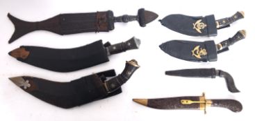 Two kukri knives in scabbards, together with a group of five other various knives (7).