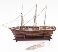A 19th Century POW bone and wood model of a twenty-six gun warship, fitted bone masts, spars,