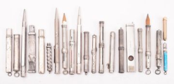 A group of silver propelling pencils and pencil holders,