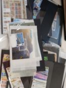 World stamps in albums, on leaves, packets, stockcards, in 2 boxes.