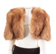 A white fur muff and matching head band, together with a collection of various fur stoles and capes.