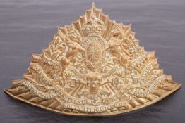 A reproduction 17th Lancers gilt brass shako plate.