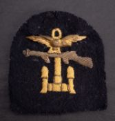 A Combined Operations shoulder badge, with gilt brass eagle and bullion embroidery.