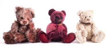 A group of three Charlie Bears, 'Bauble' 38cm high, 'Ashley' 41cm high, and 'Nora' 36cm high.