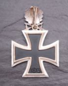 WITHDRAWN LOT A reproduction WWII German Knights Cross with Oak Leaves and Sword.
