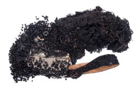 A collection of early 20th century French glass black beadwork sections and trim.