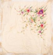 A Chinese silk shawl with floral embroidered decoration to an ivory ground, edged with fringe.
