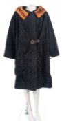 Two Astrakhan fur coats by Astra Furs, both black with brown fur collars,