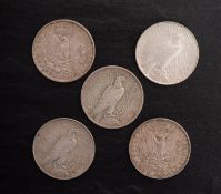 A group of five USA dollars, 1897, 1921, two 1922, and 1923.