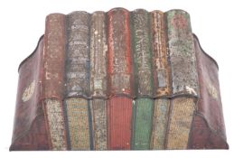 A Huntley & Palmer biscuit tin in the form of seven books between book ends, colour litho printed,