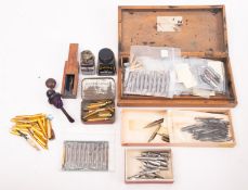 Osmiroid and other makers. A collection of various ink pen nibs and to small bottles of ink.