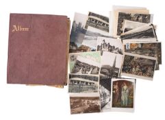An Edwardian scrap album together with a group of miscellaneous foreign topographical postcards.