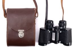 A pair of Carl Zeiss Jena 8x30W 'Jenoptem' binoculars with black crackle finish in a brown leather