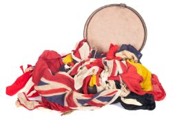 A collection of signal and other flags, including two Red Ensigns and a Stars & Stripes.