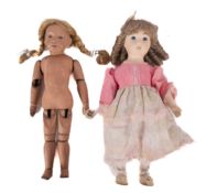 An early 20th century continental wooden articulated doll, with applied wig ,