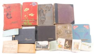 A collection of Edwardian and later postcards in albums and loose,