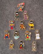A collection of thirteen Robinson Golly badges, circa 1999, including 'Bride' and 'Mermaid,
